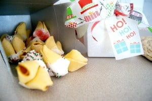 A box full of chocolate covered fortune cookies.