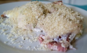 Chicken Cordon Blue served on a white plate ready to be eaten.