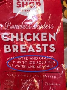 A bag of chicken breasts that shows it contains ten percent solution of water and sea salt.