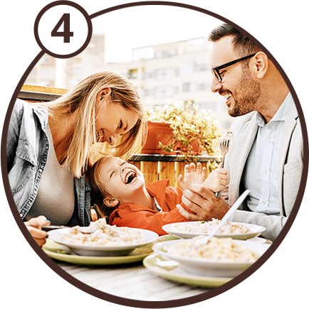 4 - Happy family eating dinner
