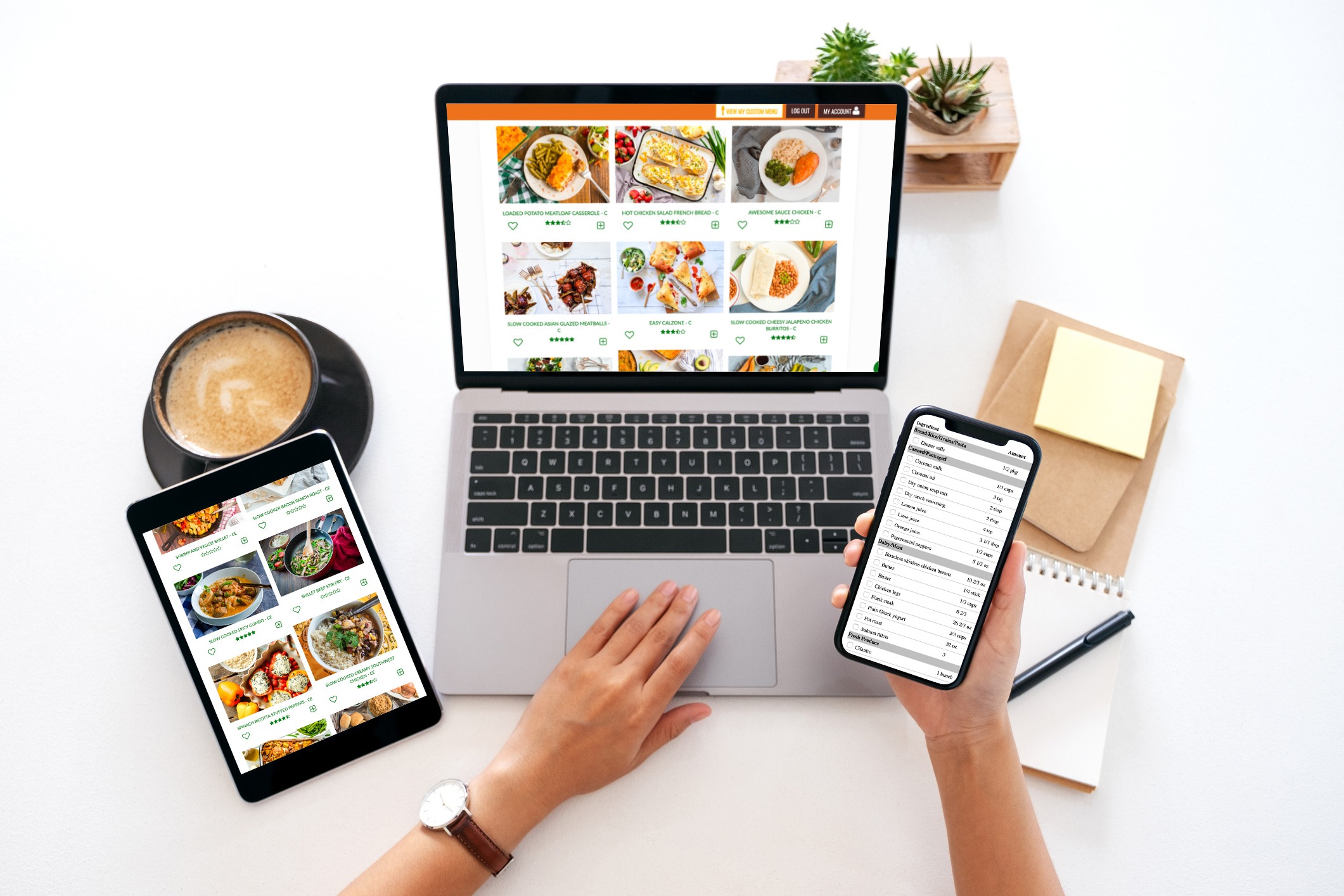 Picture of a left hand using a laptop and right hand holding a mobile phone. Both devices are running the 5 Dinners 1 Hour app.